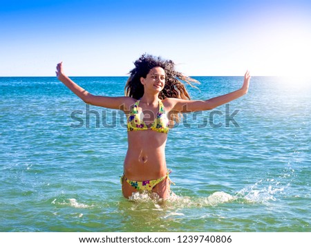 Beautiful Girl over Blue Sky and Sea. Healthy Fluttering Hair