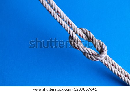 Reef Knot against blue background