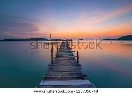 Wooden pier with amazing sunset view