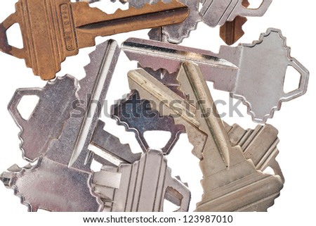 Detailed cropped shot of old metallic keys on white background.