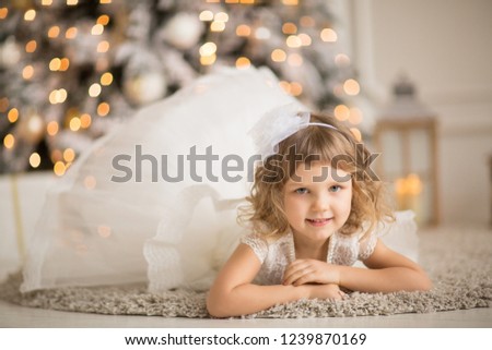 
girl in white smart dress in the New Year's scenery