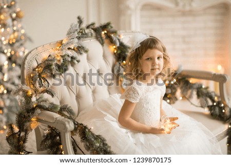 
girl in white smart dress in the New Year's scenery