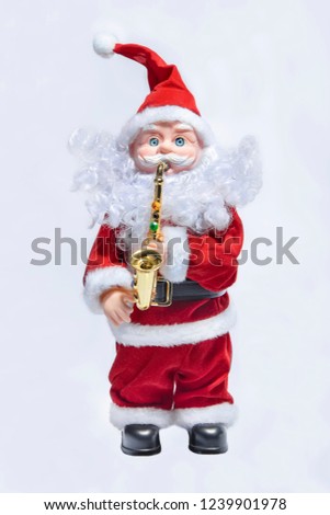 Toy Santa Claus playing the saxophone
