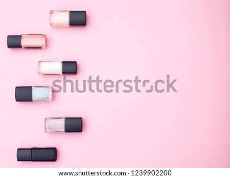 Cosmetics and accessories on a pink background. Flat lay