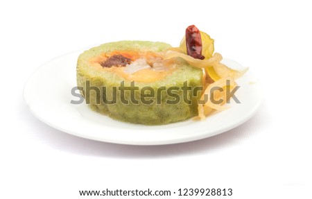 Vietnamese sticky rice with prork and egg- Banh tet. They are rice and minced bean mix with cooked pork and egg, then wrapped in banana leaves, and cooked in hot water. You can eat along with cabbage 
