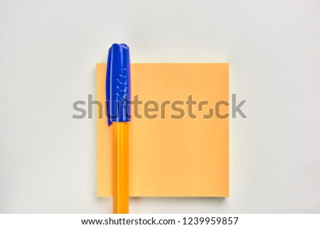 writing pen and sticker on white background