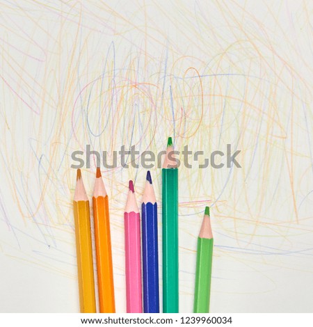 colorful pencils for drawing lie on a light background