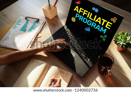 Affiliate program marketing and advertising business concept on screen. Royalty-Free Stock Photo #1240002736