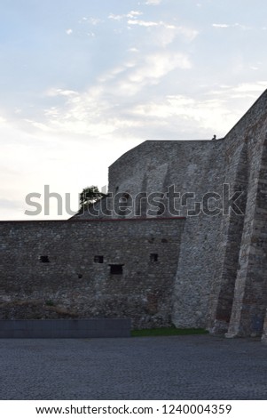 Close view of the Bratislava castle, massive rectangular building with four corner towers stands on an isolated rocky hill of the Little Carpathians directly above the Danube river
