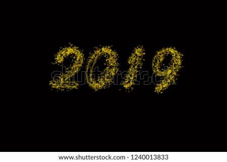 Black background 2019 article . Yellow 2019 New Year of on black background . Happy New Year Card design, web banner template, poster, lettering background .