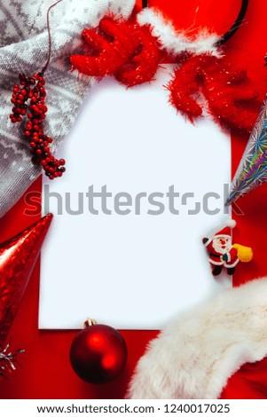 Different Christmas red and white decoration on red background with copy space. New Year greeting card concept.