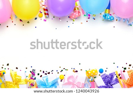 Holiday frame or background with colorful balloon, gift, confetti. Flat lay style, top view. Birthday or party greeting card with copy space.