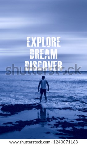 Explore dream discover quote with standing young man at the sea. Motivational concept.