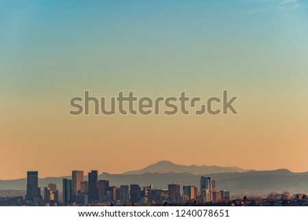 Denver skyline and mountains view at sunset