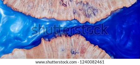 
Epoxy resin Stabilizing Afzelia burl exotic wood blue sky  background texture, Abstract art picture photo, print design and your advertisement