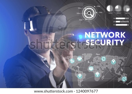 Business, Technology, Internet and network concept. Young businessman working in virtual reality glasses sees the inscription: Network security