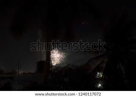 Diwali or Lights Festival Crackers Light Rays with Black and Coconut Tree Silhouette Background at North Chennai, Tamil Nadu in India