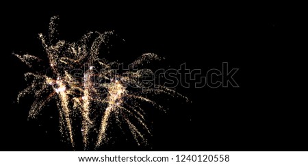 amazing fireworks in the black sky, grand spectacle at the beginning of the new year, party