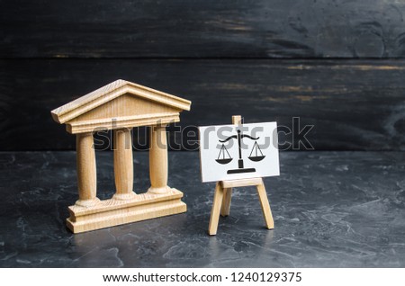 Courthouse and a sign with scales. The concept of the court and the judiciary, justice. Respect for the rights of man and citizen, the resolution of conflict situations and the issuance of verdicts.