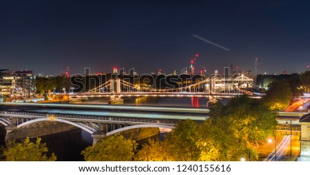 
High Resolution Panorama of the Chelsea Bridge in London from Battersea Park at night 
