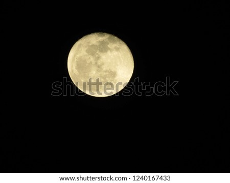 Super moon over dark black sky at night taken. Full moon background.