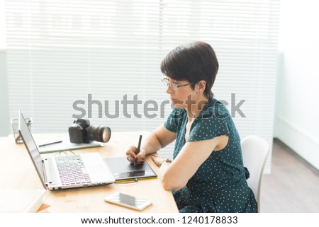 Office, graphic designer concept - Business woman hands holding digital tablet, drawing the sketch