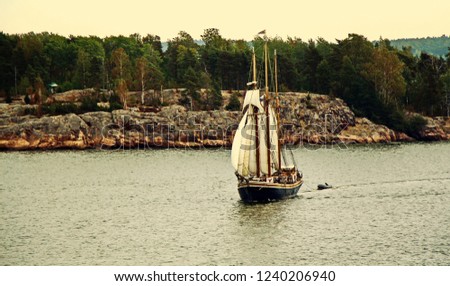 Sail ship on Baltic Sea, Helsinki. Finland. Photo in vintage image style