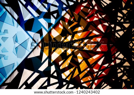 Multiple exposure photo of glass structures in different colors. Abstract multicolor background on the subject of modern architecture, construction industry or technology.
