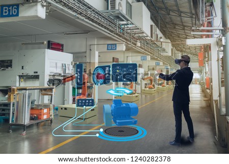 iot smart technology futuristic in industry 4.0 concept, engineer use augmented mixed virtual reality to education and training, repairs and maintenance, sales, product and site design, and more. Royalty-Free Stock Photo #1240282378
