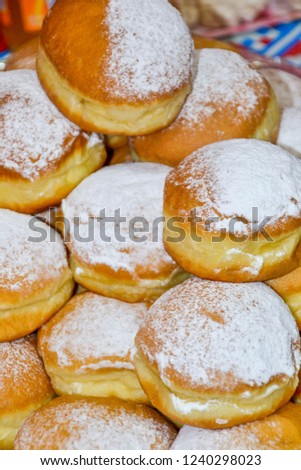 Closeup of Hanukkah sufganiyot - jelly doughnuts for Jewish festival of Hanukkah