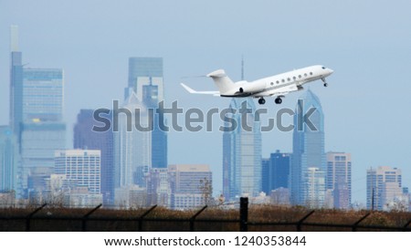 A Private Jet Flying in Front of the Philadelphia Skyline