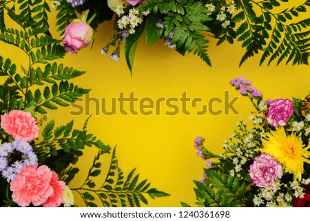 Floral picture frame concept. Placed on a yellow background to enter text, copy space.