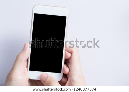 Blank smartphone with hand isolated on white background.