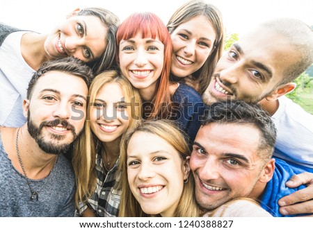 Happy best friends taking selfie outdoors with desaturated backlighting - Youth and friendship concept with young people having fun together - Bright vintage filter with soft sunshine color tones