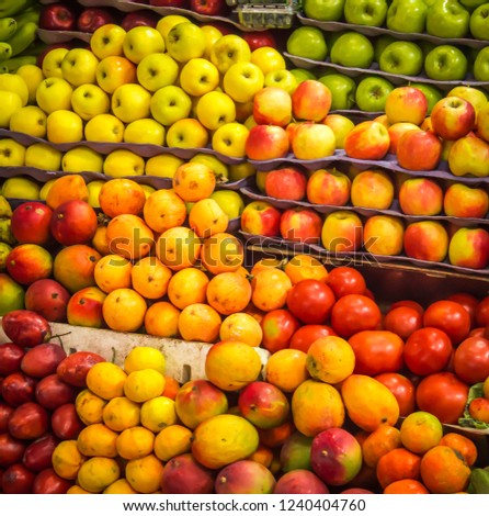 colorful photograph of well-to-do fruits in a Latino market