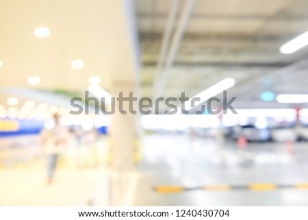 Blurred bokeh of car park indoor building, Transport business background