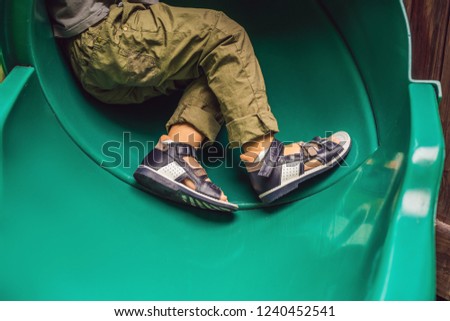 children's orthopedic shoes on the boy's feet