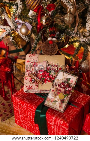 Beautiful Christmas tree with gifts in the room