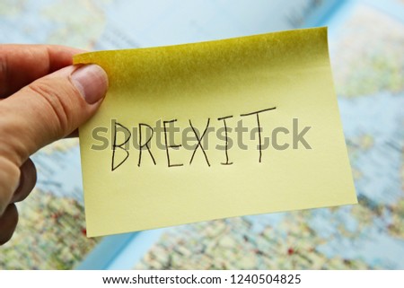Brexit deal concept image consisting of a post it and a map in the background. 