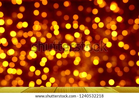 wooden table of free space for your product and xmas tree blurred background 