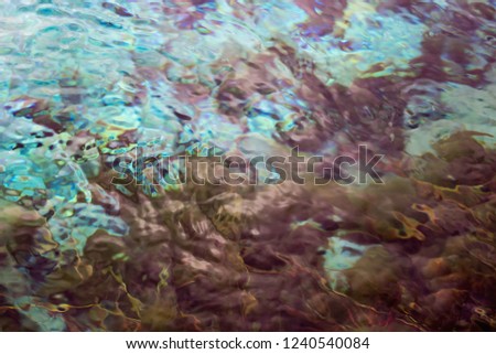 Abstract nature background image of the clear fresh water of Waikoropupu Springs, New Zealand.