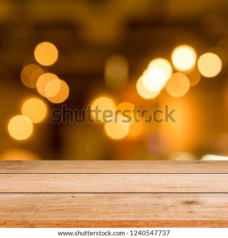 old vintage grungy brown wood panel tabletop with blurred restaurant bar cafe light color background for show,promote and advertise product on display