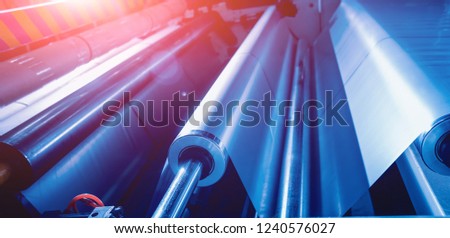 Modern automated production line in factory. Plastic bag manufacturing process. Background Royalty-Free Stock Photo #1240576027