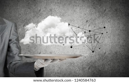 Cropped image of waitress's hand in white glove presenting cloud with social media network structure on metal tray. Gray wall on background. 3D rendering.