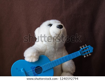 a polar bear with guitar on black background