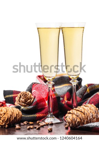 two glasses with champagne on a festive background