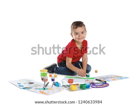 Cute child painting picture on white background