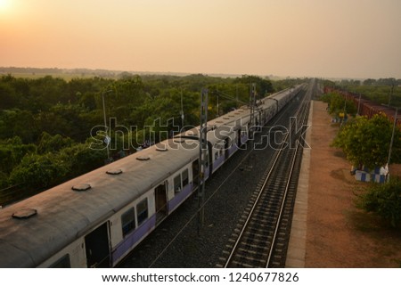 High angle view of railway tracks and train standing on a station