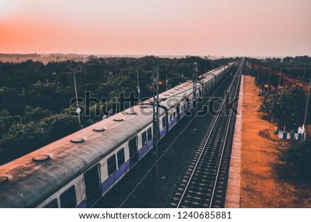 Train standing at a station, view from high angle, drone shot