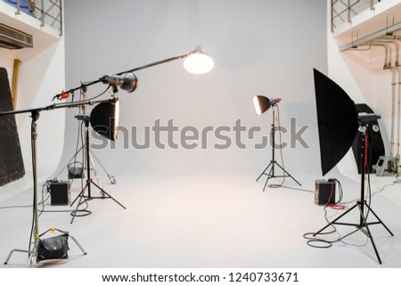 Empty studio with photography lighting Royalty-Free Stock Photo #1240733671
